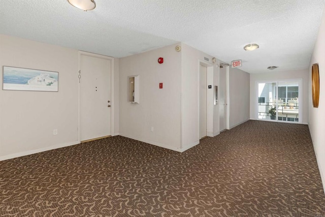 3421 Park Blvd Unit 401, San Diego, CA 92103 - unfurnished room with carpet, a textured ceiling, and baseboards