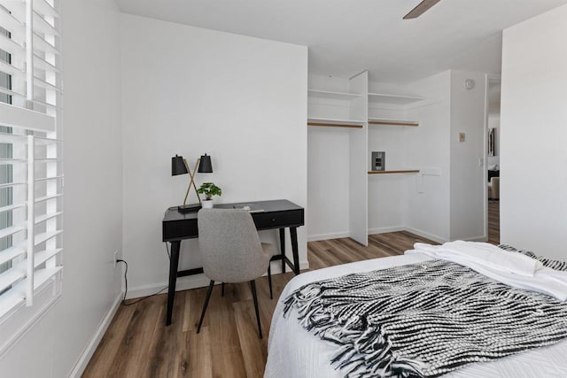 3421 Park Blvd Unit 401, San Diego, CA 92103 - bedroom featuring wood finished floors, multiple windows, and baseboards