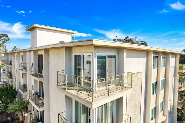 3421 Park Blvd Unit 401, San Diego, CA 92103 - view of property exterior with stucco siding and a balcony