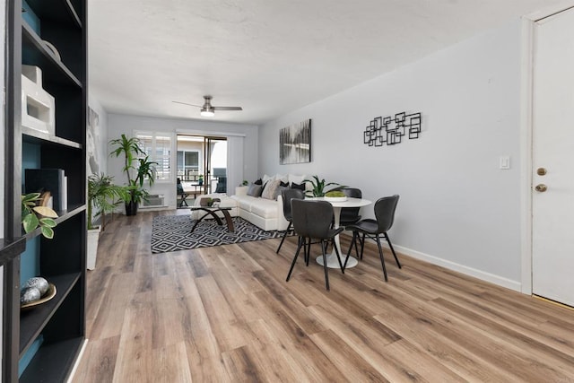 3421 Park Blvd Unit 401, San Diego, CA 92103 - living area with light wood-style flooring, a ceiling fan, and baseboards