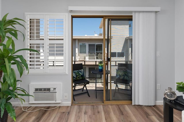 3421 Park Blvd Unit 401, San Diego, CA 92103 - entryway featuring wood finished floors, an AC wall unit, baseboards, and plenty of natural light