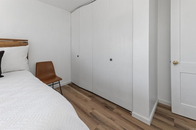 3421 Park Blvd Unit 401, San Diego, CA 92103 - bedroom with wood finished floors, baseboards, and a closet