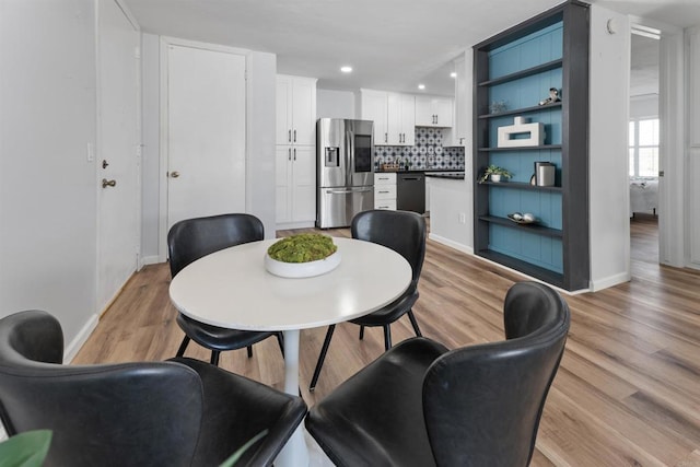 3421 Park Blvd Unit 401, San Diego, CA 92103 - dining area with baseboards, light wood finished floors, and recessed lighting