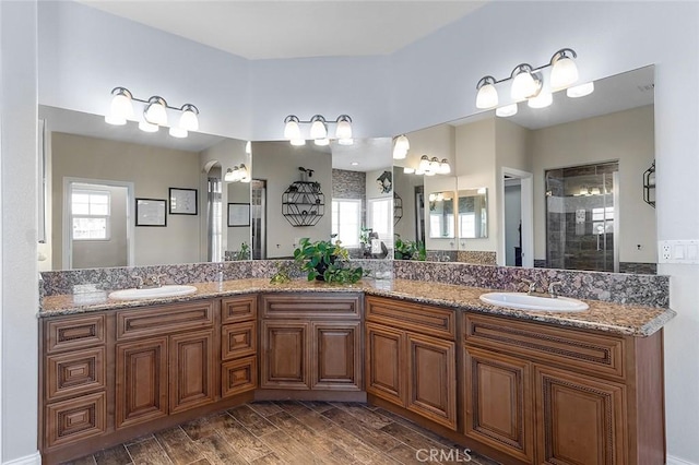 7922 Los Palmas Dr, Oak Hills, CA 92344 - full bathroom featuring wood tiled floor, a sink, and plenty of natural light