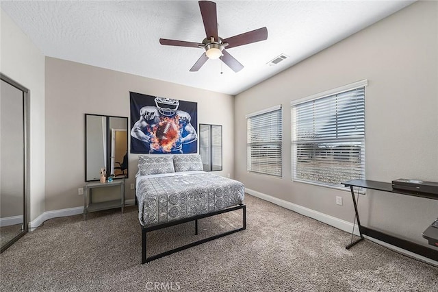7922 Los Palmas Dr, Oak Hills, CA 92344 - carpeted bedroom with visible vents, a textured ceiling, baseboards, and a ceiling fan