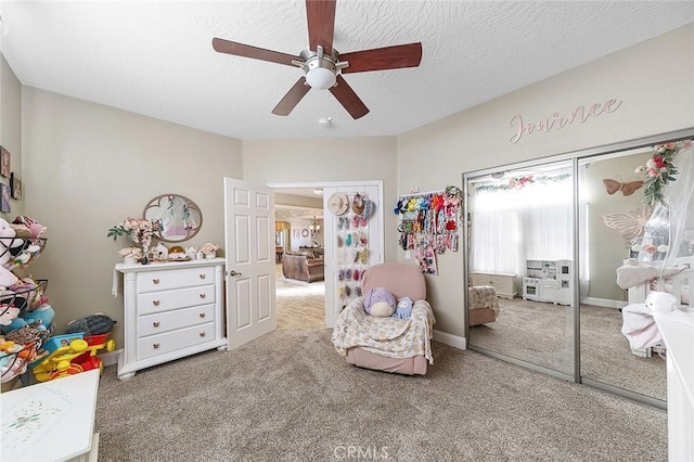 7922 Los Palmas Dr, Oak Hills, CA 92344 - bedroom with a closet, baseboards, a textured ceiling, carpet floors, and ceiling fan