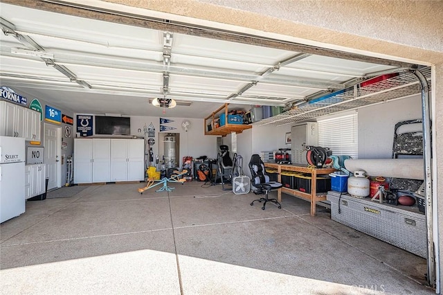 7922 Los Palmas Dr, Oak Hills, CA 92344 - garage featuring freestanding refrigerator