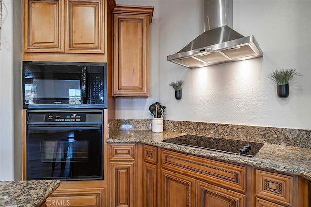 7922 Los Palmas Dr, Oak Hills, CA 92344 - kitchen with brown cabinetry, black appliances, wall chimney exhaust hood, and stone countertops