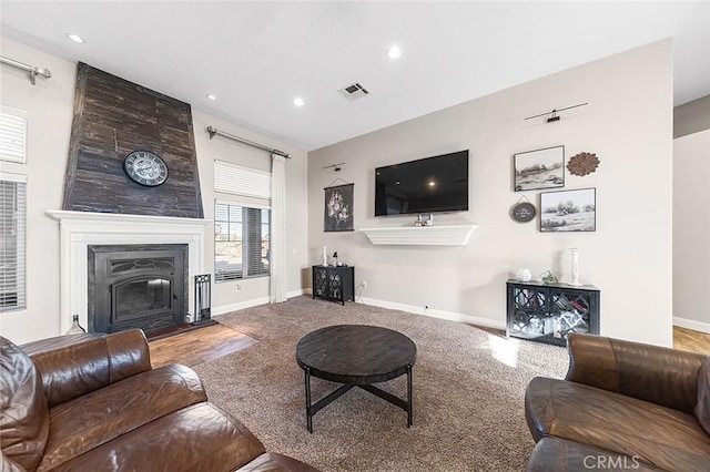7922 Los Palmas Dr, Oak Hills, CA 92344 - living area with recessed lighting, a fireplace, visible vents, and baseboards