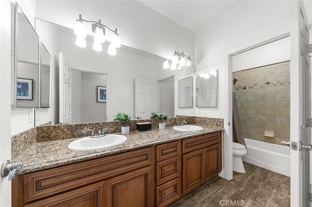 7922 Los Palmas Dr, Oak Hills, CA 92344 - bathroom with toilet, shower / bath combination, double vanity, and a sink
