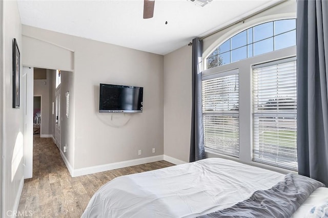 7922 Los Palmas Dr, Oak Hills, CA 92344 - bedroom featuring baseboards, a ceiling fan, and wood finished floors