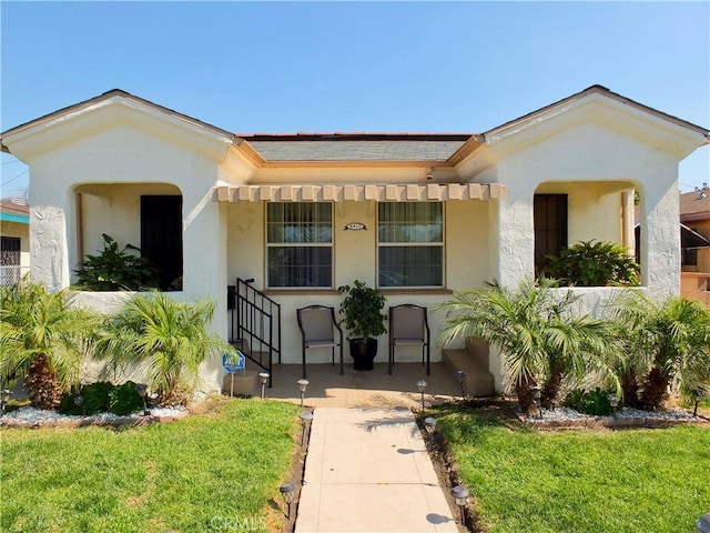 8912 Mettler St, Los Angeles, CA 90003 - view of front of house featuring a front lawn and stucco siding