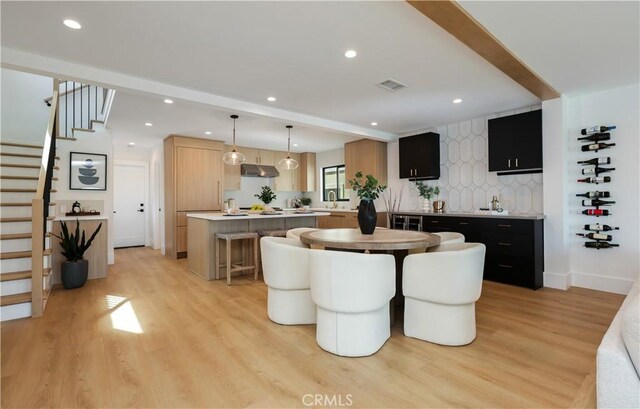 dining space with stairway, visible vents, recessed lighting, and light wood-style floors