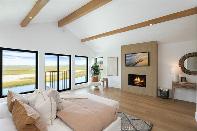 bedroom featuring recessed lighting, lofted ceiling with beams, light wood-style floors, access to exterior, and a fireplace