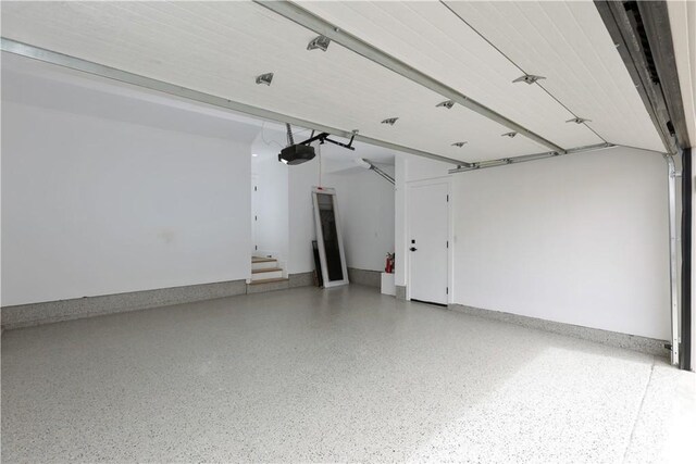 garage featuring a garage door opener