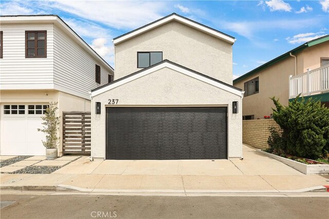 traditional-style home featuring stucco siding and driveway