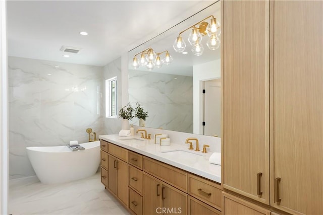 237 Canal St, Newport Beach, CA 92663 - full bathroom featuring double vanity, tile walls, a soaking tub, and marble finish flooring