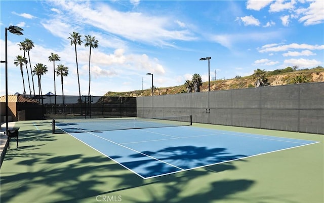 view of sport court with fence and community basketball court