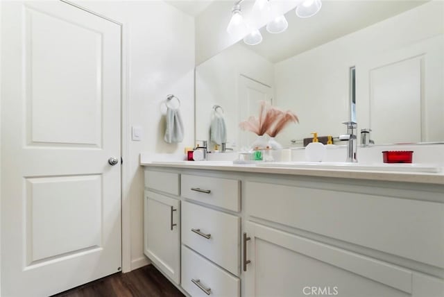 bathroom featuring vanity and wood finished floors