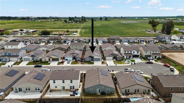 birds eye view of property with a residential view
