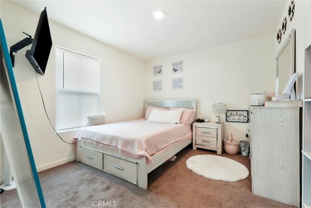 bedroom featuring carpet flooring and baseboards