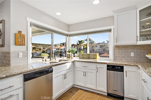 30249 Spray Dr, Canyon Lake, CA 92587 - kitchen featuring stainless steel dishwasher, white cabinetry, a wealth of natural light, and decorative backsplash