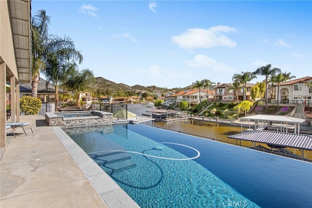30249 Spray Dr, Canyon Lake, CA 92587 - view of swimming pool with a water view, a patio area, an in ground hot tub, a boat dock, and a residential view