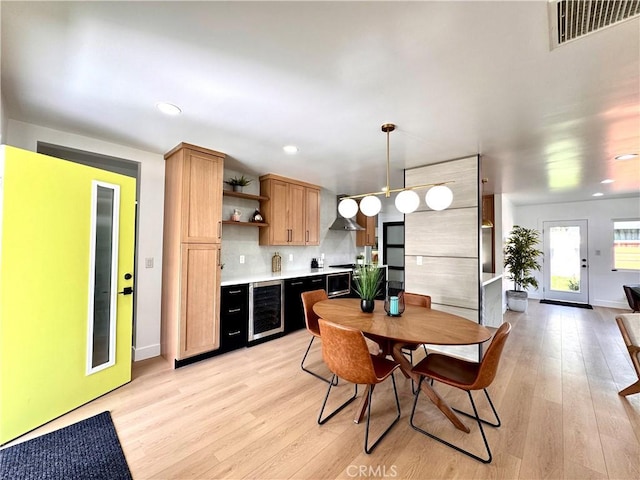 kitchen featuring wine cooler, light wood finished floors, open shelves, and visible vents