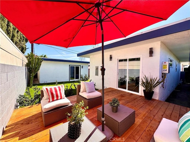 deck with an outdoor living space and fence private yard