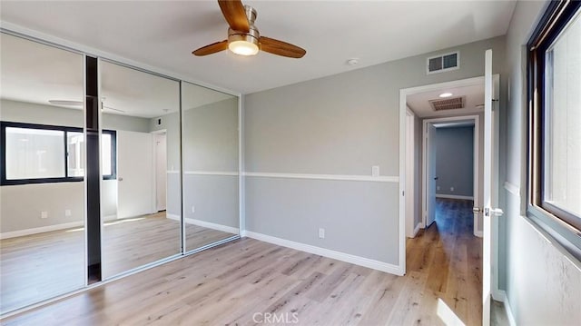 27130 Hidaway Ave Unit 6, Canyon Country, CA 91351 - unfurnished bedroom with light wood-type flooring, a closet, baseboards, and ceiling fan