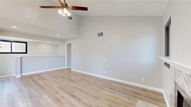 27130 Hidaway Ave Unit 6, Canyon Country, CA 91351 - unfurnished living room featuring ceiling fan, light wood-type flooring, lofted ceiling, baseboards, and recessed lighting
