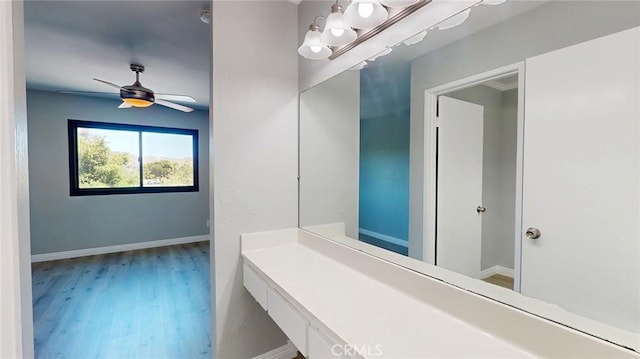 27130 Hidaway Ave Unit 6, Canyon Country, CA 91351 - bathroom featuring wood finished floors, baseboards, a chandelier, and ceiling fan