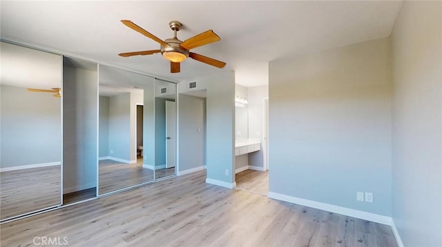 27130 Hidaway Ave Unit 6, Canyon Country, CA 91351 - unfurnished bedroom featuring light wood-style flooring, a closet, baseboards, ceiling fan, and ensuite bathroom