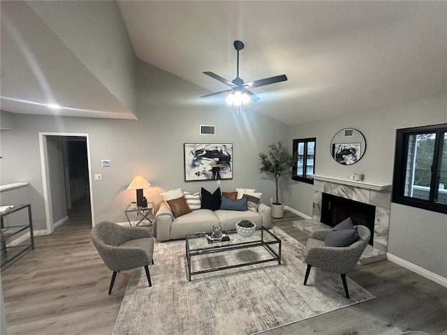 27130 Hidaway Ave Unit 6, Canyon Country, CA 91351 - living area featuring wood finished floors, ceiling fan, lofted ceiling, and healthy amount of natural light