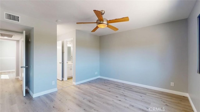 27130 Hidaway Ave Unit 6, Canyon Country, CA 91351 - unfurnished bedroom with light wood-type flooring, baseboards, a ceiling fan, and ensuite bath
