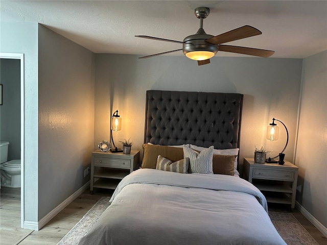 27130 Hidaway Ave Unit 6, Canyon Country, CA 91351 - bedroom with light wood finished floors, baseboards, ensuite bathroom, and ceiling fan