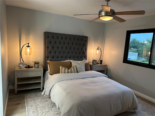 27130 Hidaway Ave Unit 6, Canyon Country, CA 91351 - bedroom featuring baseboards, wood finished floors, and a ceiling fan