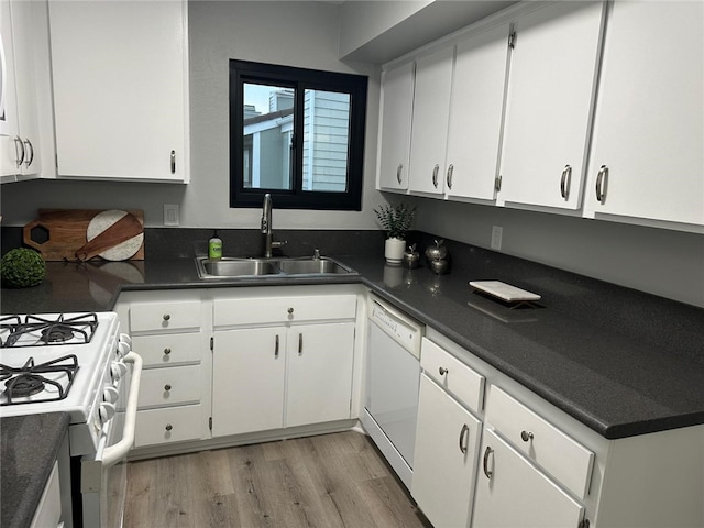 27130 Hidaway Ave Unit 6, Canyon Country, CA 91351 - kitchen with a sink, white appliances, white cabinetry, light wood finished floors, and dark countertops
