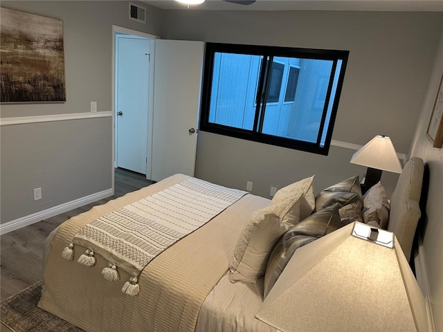 27130 Hidaway Ave Unit 6, Canyon Country, CA 91351 - bedroom with dark wood finished floors and baseboards