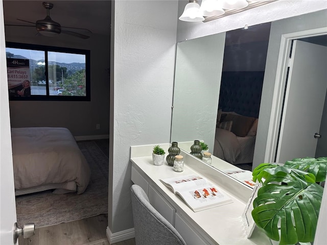 27130 Hidaway Ave Unit 6, Canyon Country, CA 91351 - ensuite bathroom with wood finished floors, baseboards, and vanity