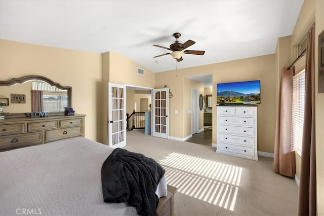 carpeted bedroom featuring visible vents, french doors, baseboards, and lofted ceiling