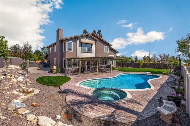 view of pool with a patio area, a pool with connected hot tub, and a fenced backyard