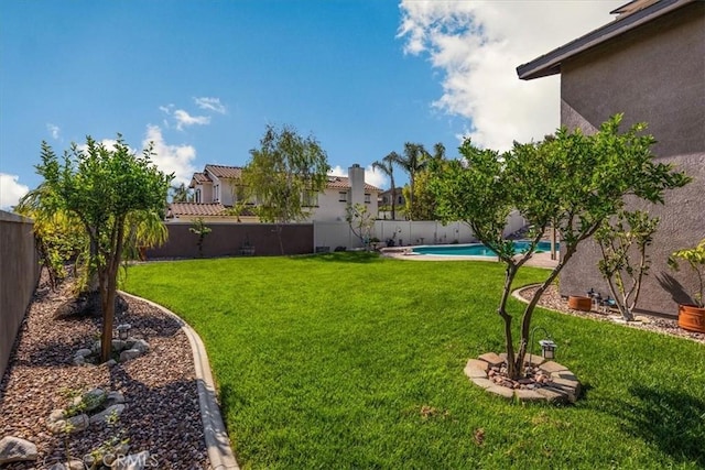 view of yard with a fenced in pool and a fenced backyard