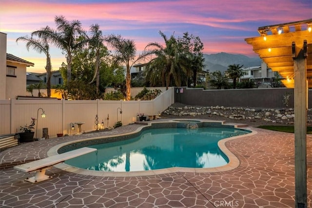view of swimming pool featuring a patio area, a fenced in pool, and a fenced backyard
