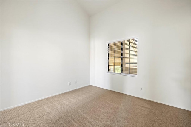 18217 Flynn Dr Unit 116, Canyon Country, CA 91387 - carpeted spare room with baseboards and vaulted ceiling