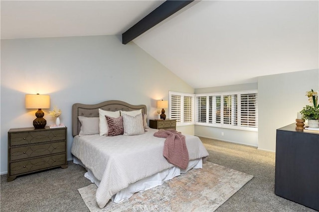 bedroom with lofted ceiling with beams and carpet