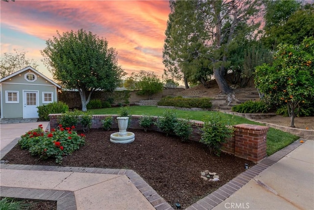 view of yard featuring an outdoor structure and fence
