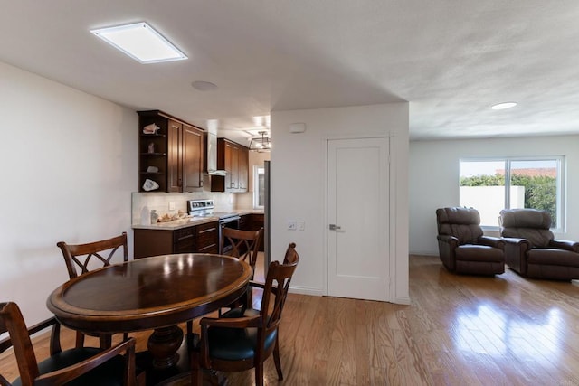 6462 Camino Del Parque, Carlsbad, CA 92011 - dining room with wood finished floors and baseboards