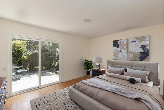 6462 Camino Del Parque, Carlsbad, CA 92011 - bedroom featuring access to exterior and wood finished floors