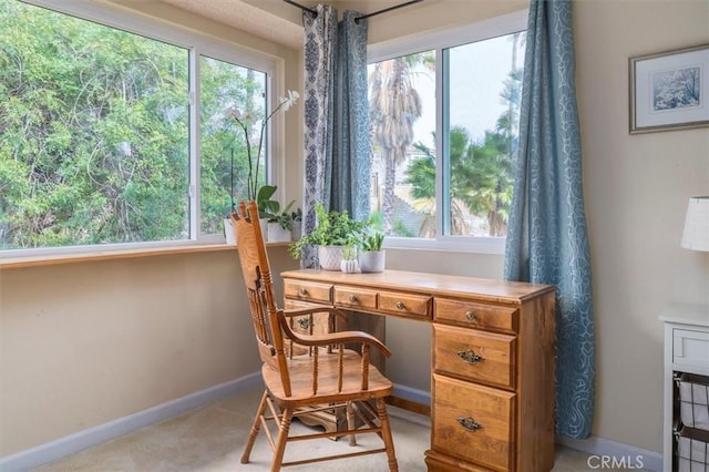 office area with baseboards and plenty of natural light
